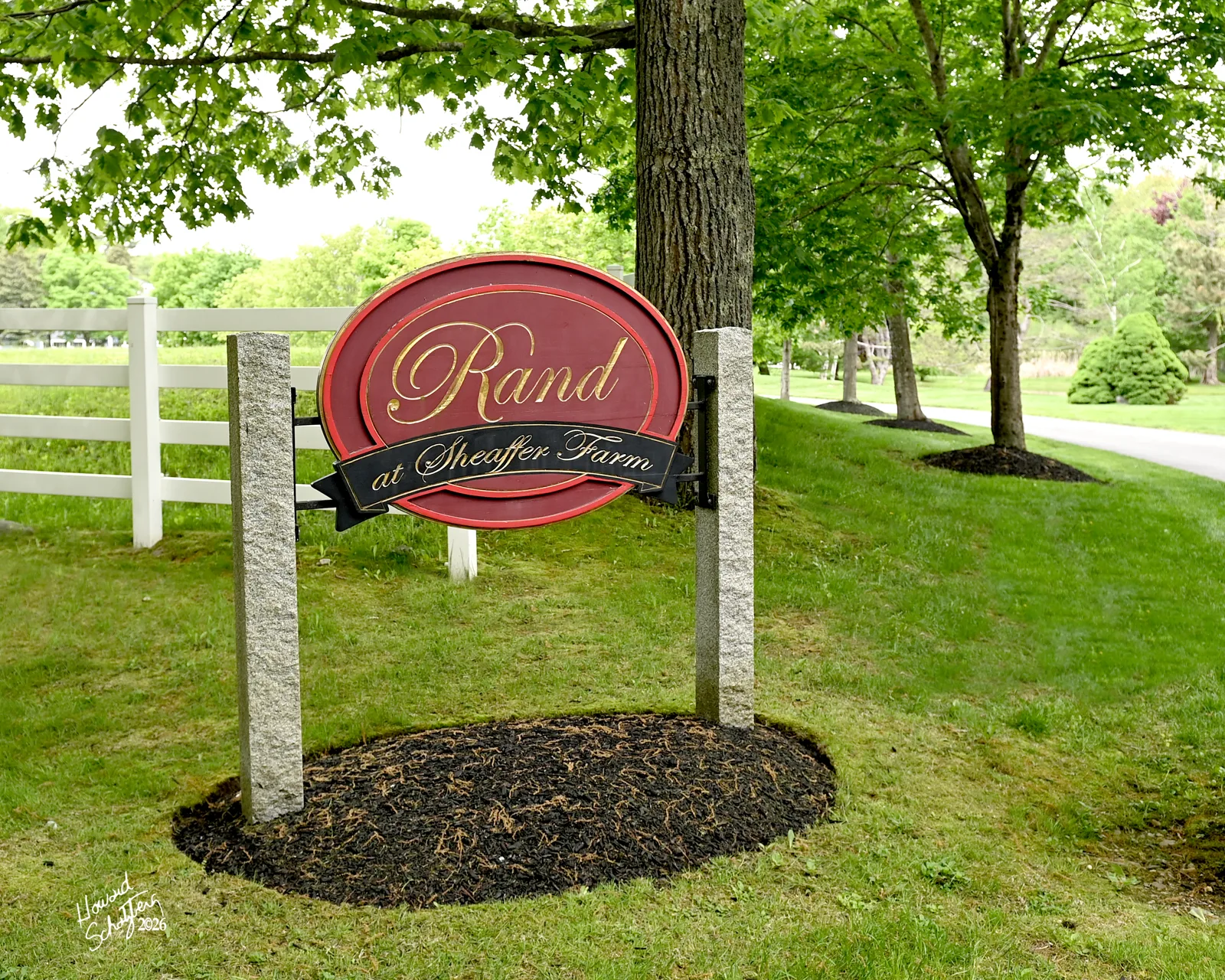 Rand Stables sign beside the tree-lined farm drive